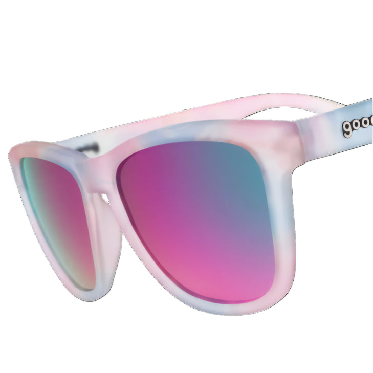 Sunglasses with pink and blue gradient lenses and a white frame on a white background